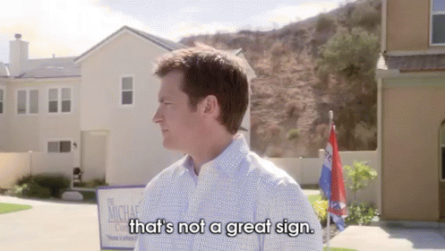 a man standing in front of a house says that 's not a great sign .
