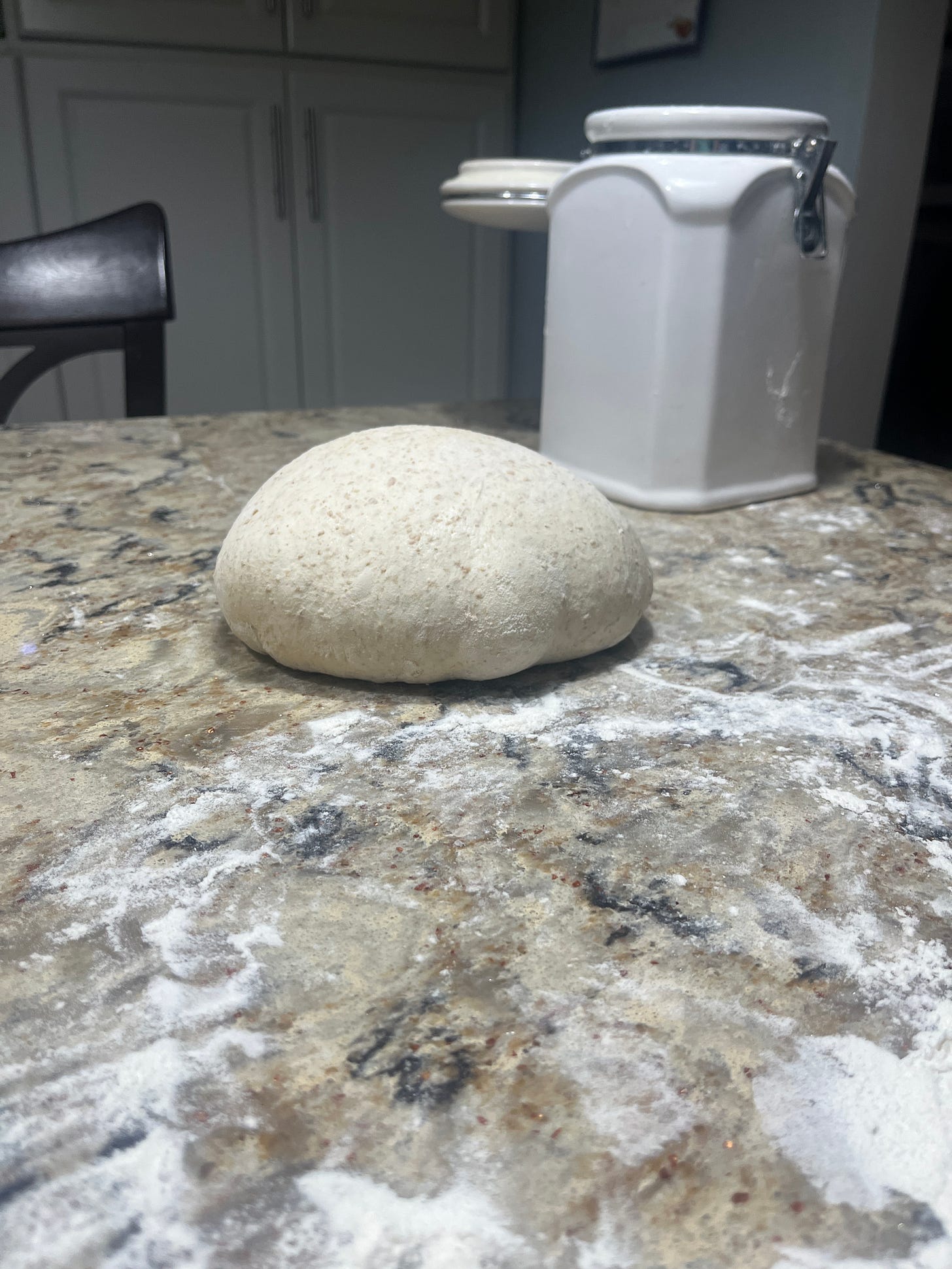 a round ball of dough on a counter