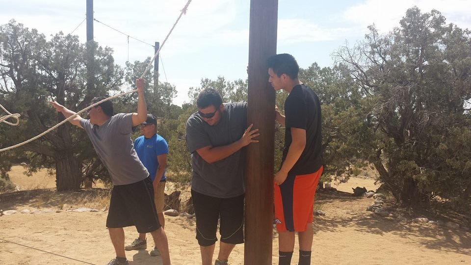 Newman Club students enjoy a day at an adventure ropes course.