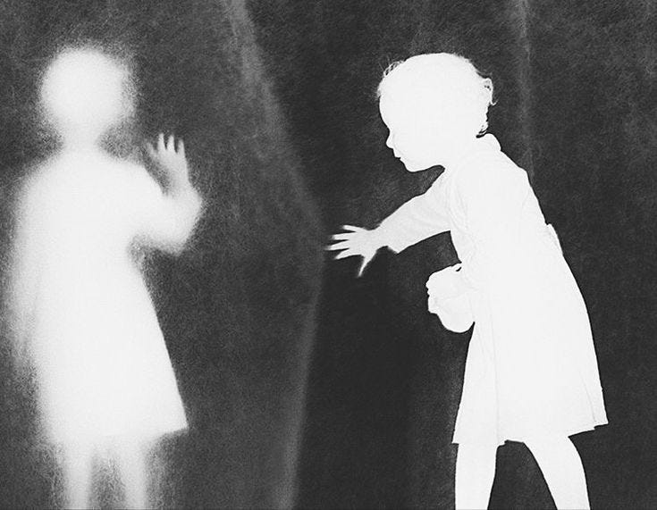 This may contain: a black and white photo of a child standing in front of a shadow