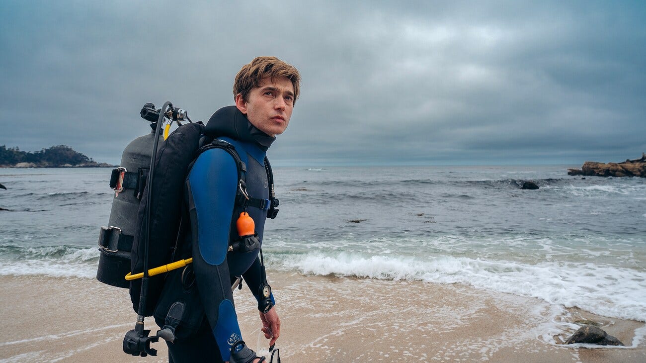 Austin Abrams as Jay Gardiner in 20th Century Studios' WHALEFALL. Photo by Jennifer Clasen. © 2026 20th Century Studios. All Rights Reserved. Austin Abrams as Jay Gardiner in 20th Century Studios' WHALEFALL. Photo by Jennifer Clasen. © 2026 20th Century Studios. All Rights Reserved.