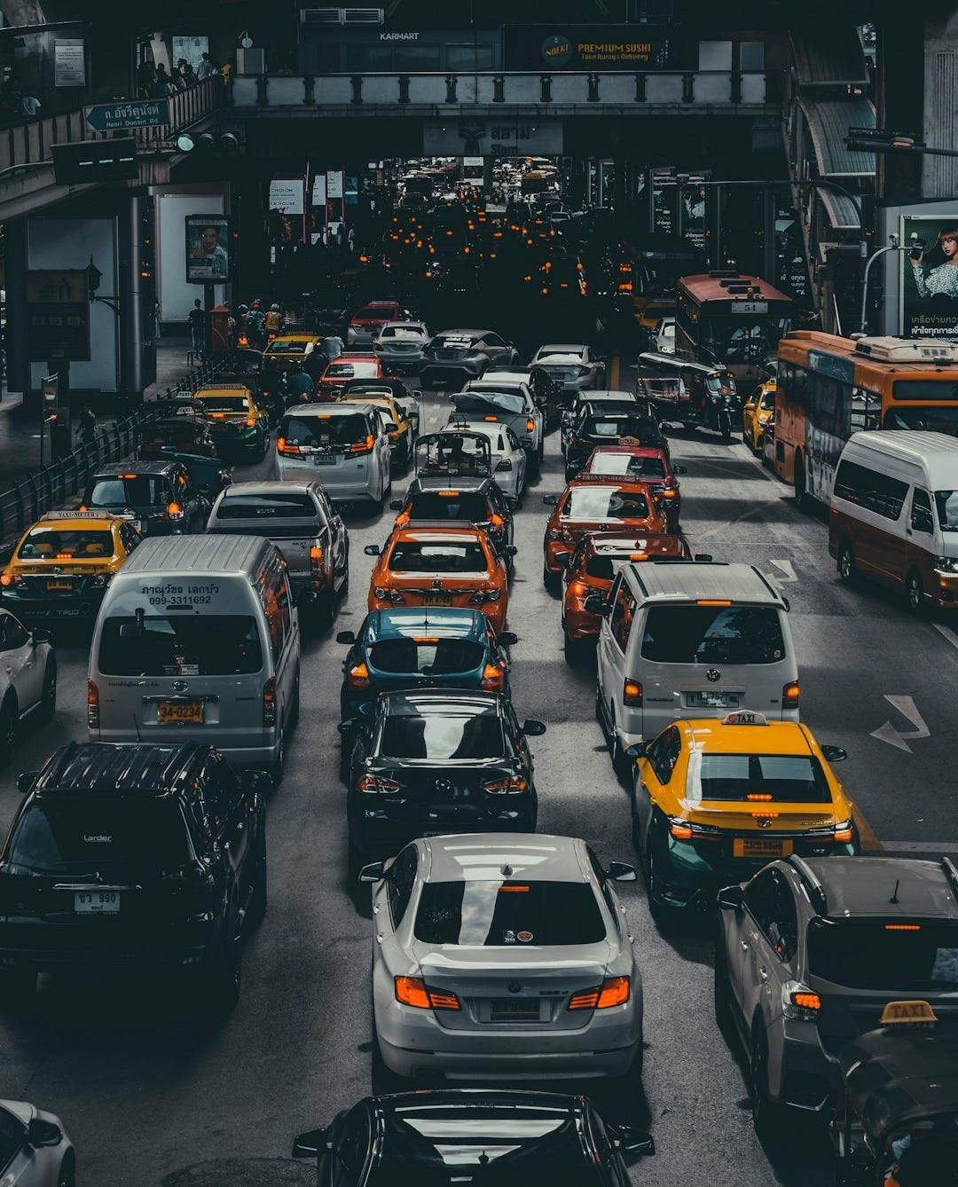 assorted vehicles on road at daytime assorted vehicles on road at daytime