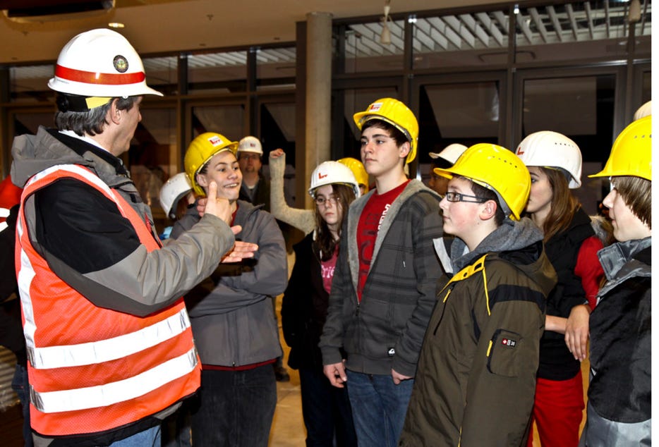 A group of people wearing helmets

Description automatically generated with medium confidence