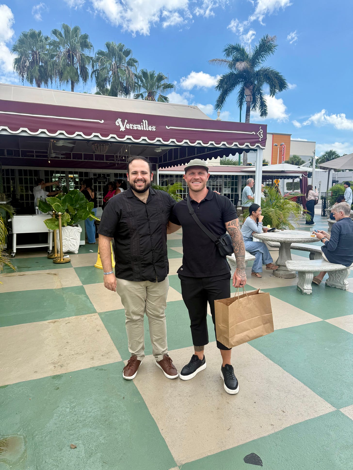 The author with a friend in front of Versailles