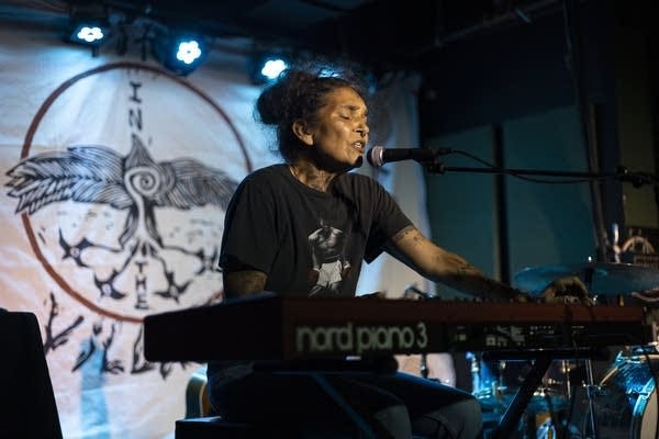 A person plays a keyboard