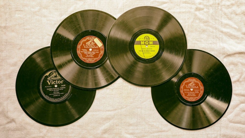 4 78rpm records spread out on textile 4 78rpm records spread out on textile