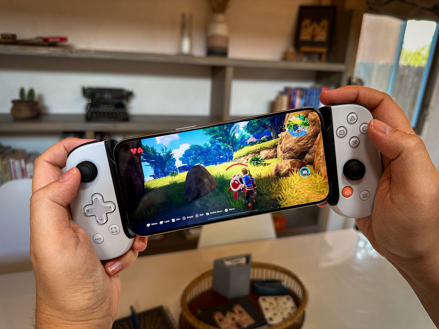 BackBone controller on an iPhone 15 Pro Max playing a game BackBone controller on an iPhone 15 Pro Max playing a game