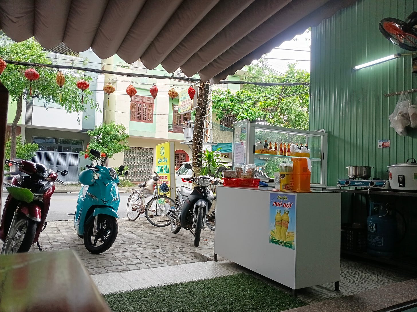 looking outside a restaurant from a table at motorbikes parked