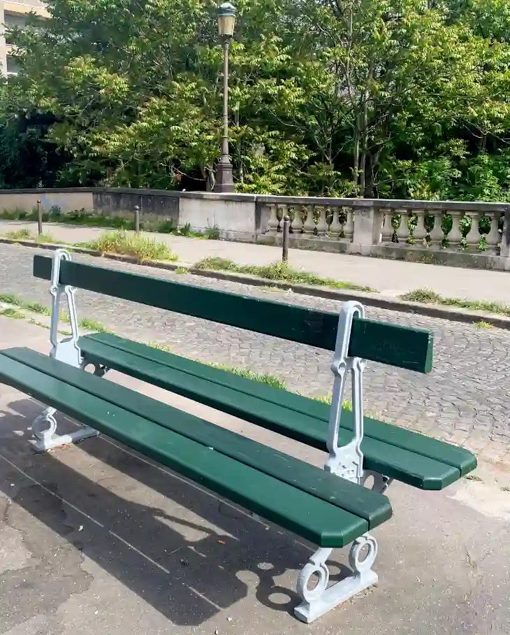 Photo of a traditional 19th-century-style bench in Paris. Photo of a traditional 19th-century-style bench in Paris.