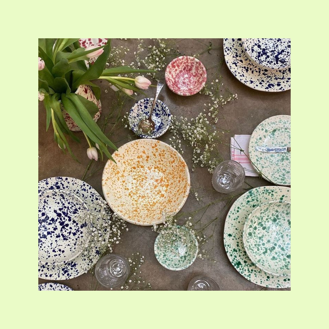 A photo of paint-splattered ceramic dishware.