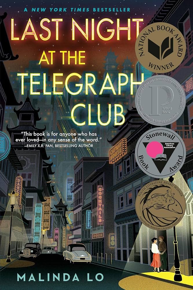 cover of Malinda Lo's Last Night At the Telegraph Club; art deco drawing of street in Chinatown, off to the side in a streetlight in an alcover a woman in a red dress and white blouse holds hands with a woman in boys' clothing cover of Malinda Lo's Last Night At the Telegraph Club; art deco drawing of street in Chinatown, off to the side in a streetlight in an alcover a woman in a red dress and white blouse holds hands with a woman in boys' clothing
