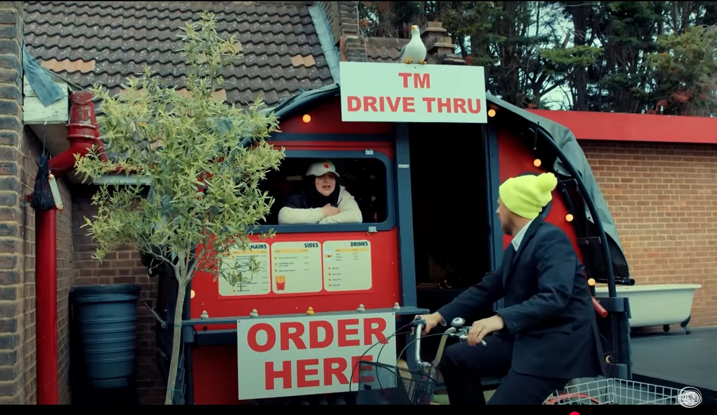Fatiha El-Ghorri takes an order at the TM Drive Thru.