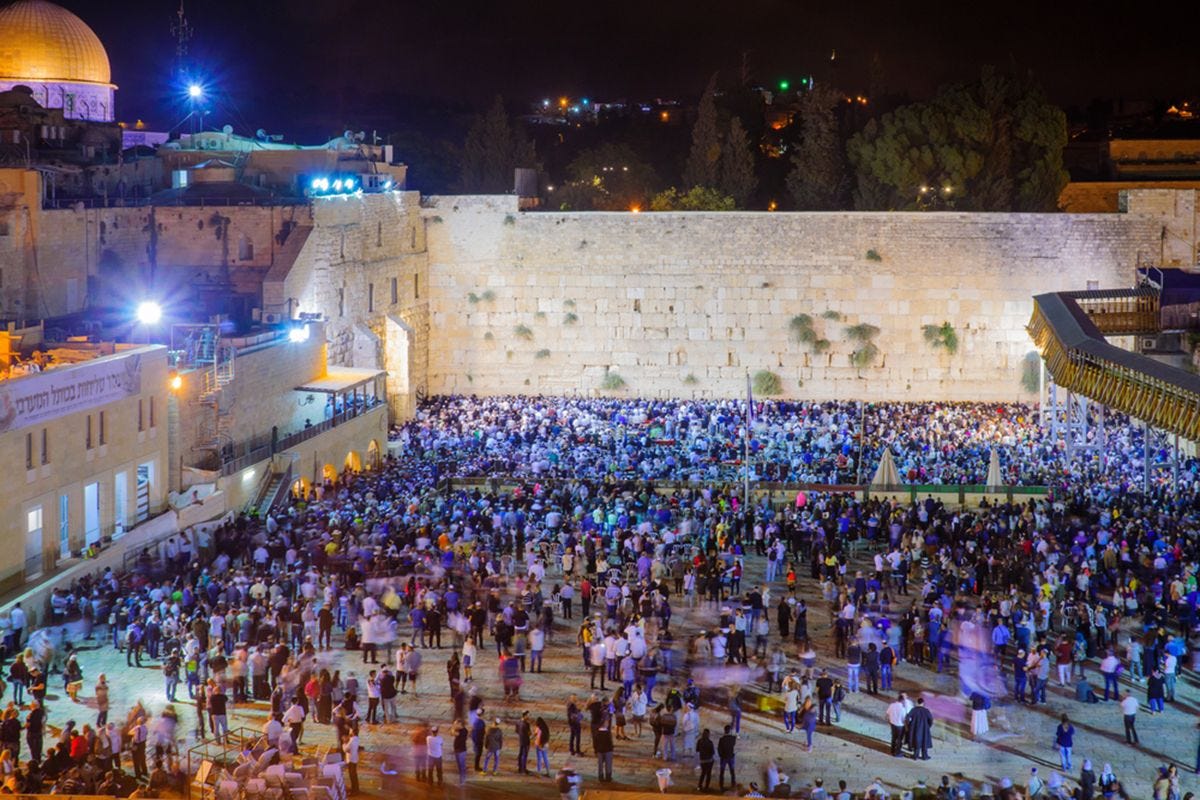 JERUSALEM, SEPTEMBER 23, 2016: Scene of the Western Wall with a huge crowd of Selichot (Jewish penitential prays) prayers, an annual tradition. JERUSALEM, SEPTEMBER 23, 2016: Scene of the Western Wall with a huge crowd of Selichot (Jewish penitential prays) prayers, an annual tradition.