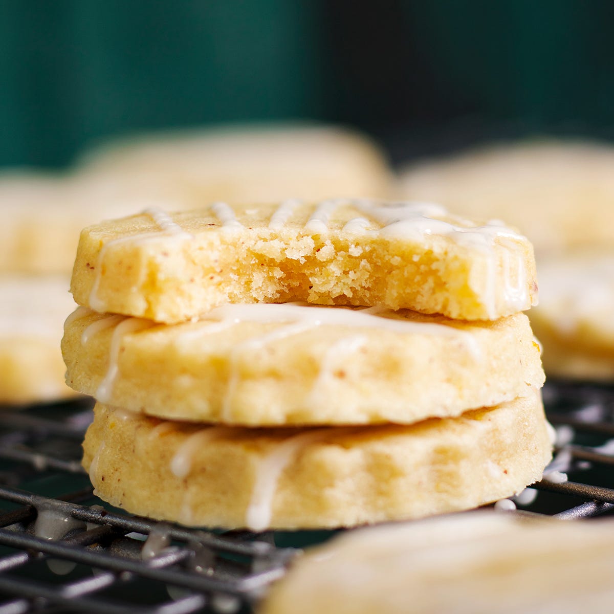A stack of three brown butter citrus shortbread cookies.