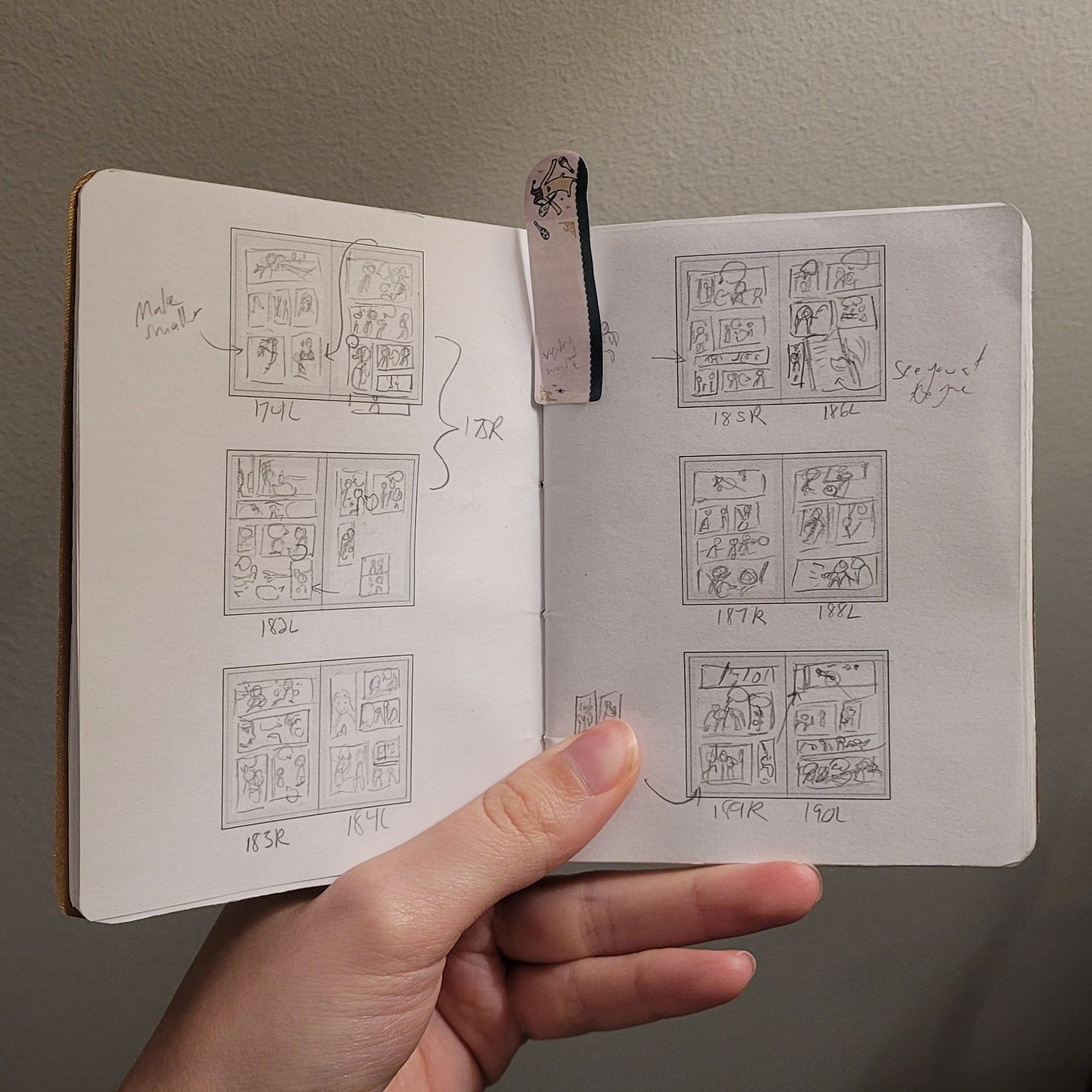 Mini sketchbook with illustration of comics inside.