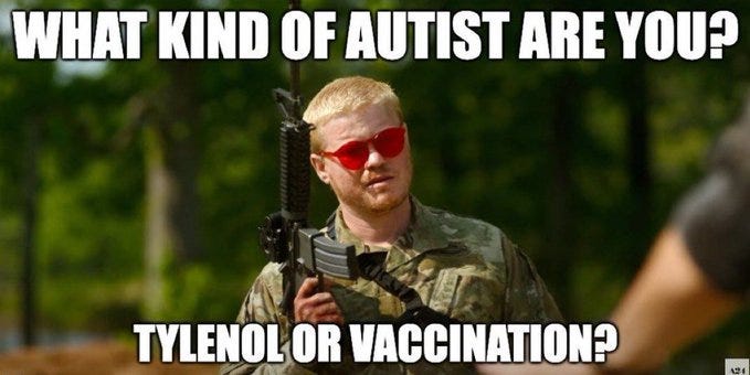 A person in military camouflage holding a rifle, wearing red sunglasses. The background shows a green outdoor setting with trees.