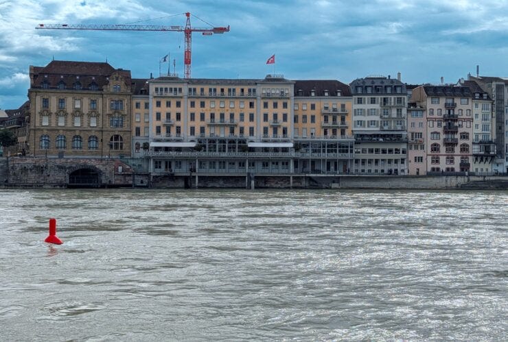 Hotels along the Rhine River in Basel. The river is high and fast. 