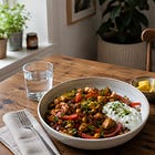 Spiced Chicken and Chickpeas with Herbed Yogurt, the Warm Bowl That Protects Your Muscle