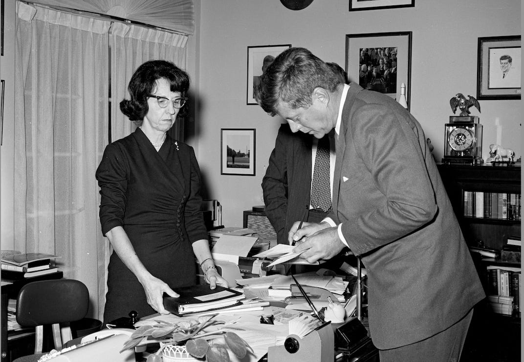 Evelyn Lincoln, left, with President John F. Kennedy. (Credit:Robert Knudsen. White House Photographs. John F. Kennedy Presidential Library and Museum, Boston)