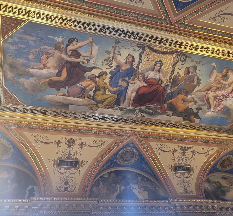 A ceiling with a painting on it

AI-generated content may be incorrect.