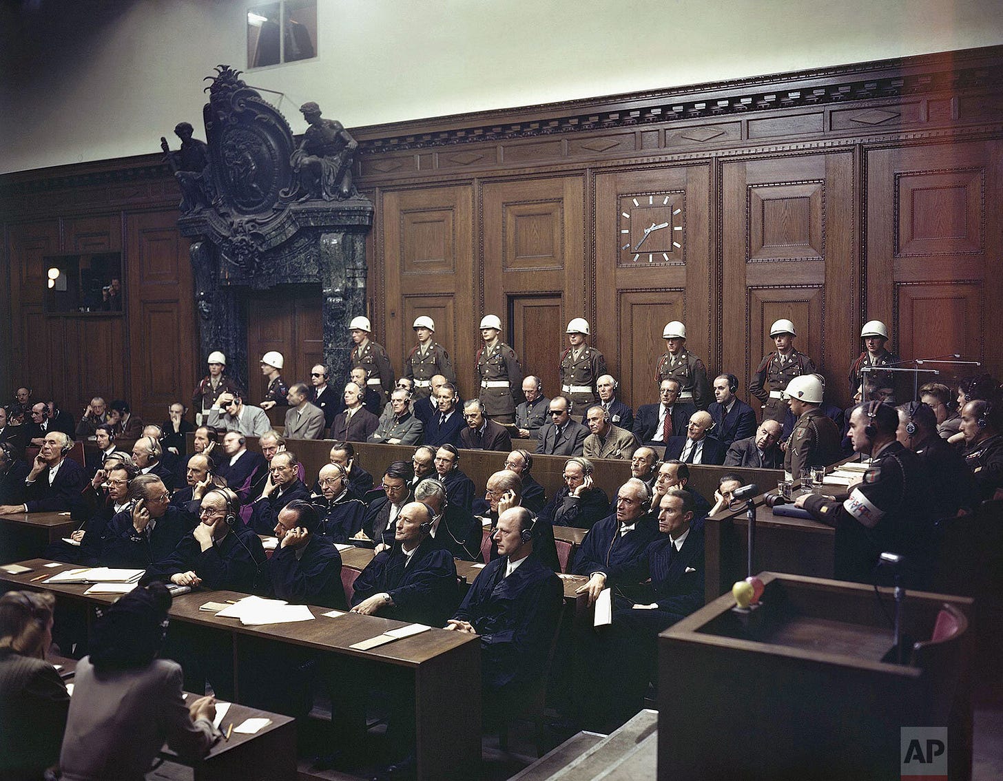 The gravity of the moment: Defendants listen intently to part of their verdict in the Palace of Justice during the Nuremberg War Crimes Trial on September 30, 1946. In the front row of the prisoner's dock, from left: Hermann Goering (wearing dark glasses), Rudolf Hess, and other key figures await their fate. The gravity of the moment: Defendants listen intently to part of their verdict in the Palace of Justice during the Nuremberg War Crimes Trial on September 30, 1946. In the front row of the prisoner's dock, from left: Hermann Goering (wearing dark glasses), Rudolf Hess, and other key figures await their fate.