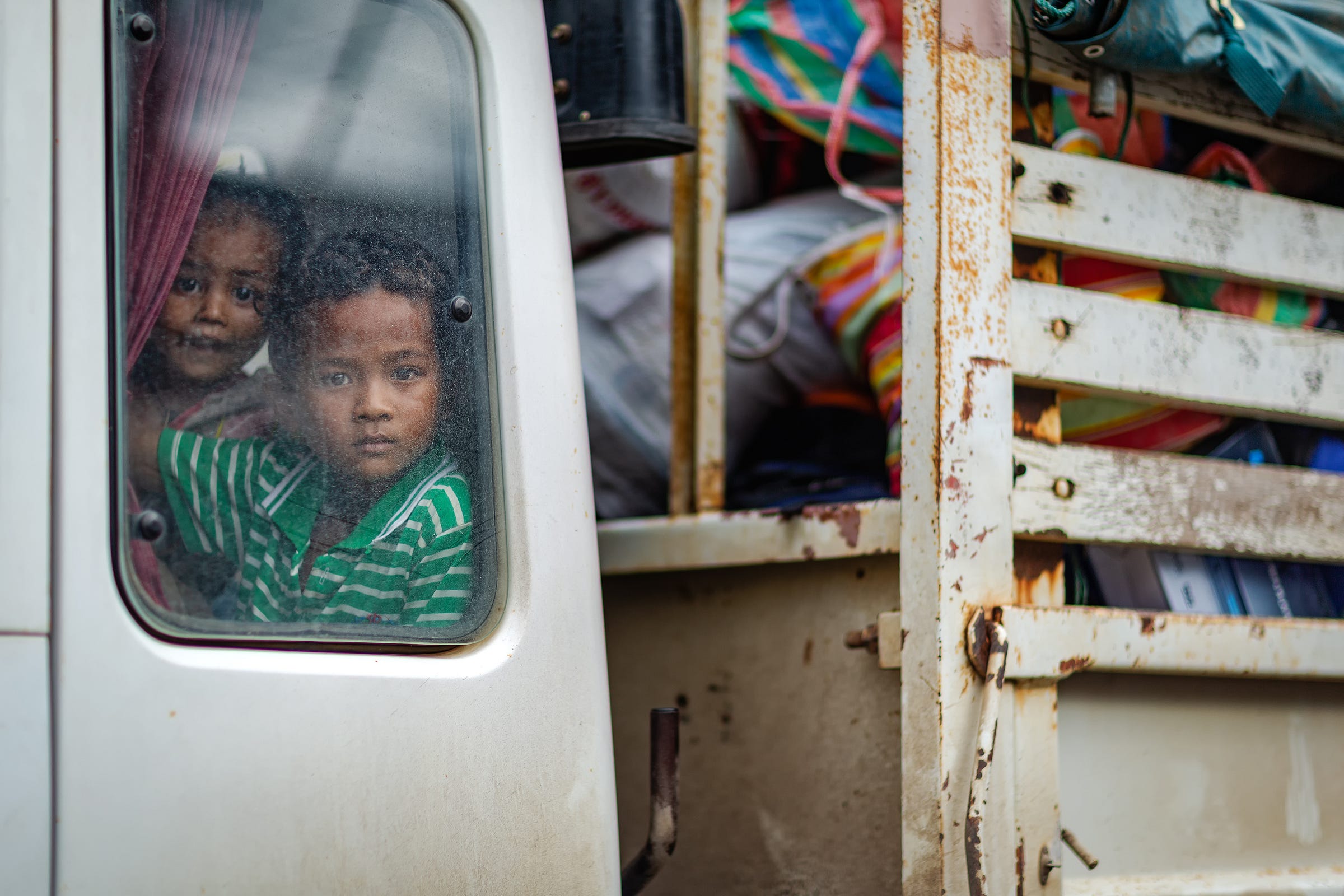 Cambodian children in a truck at the Thai/Cambodia border. © Gavin Gough