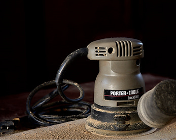 Final image of  power sander on a board