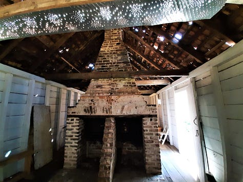 A small white building with a shingle roof that is the slave quarters at Hopsewee. Second and third photos show the large brick center fireplace.