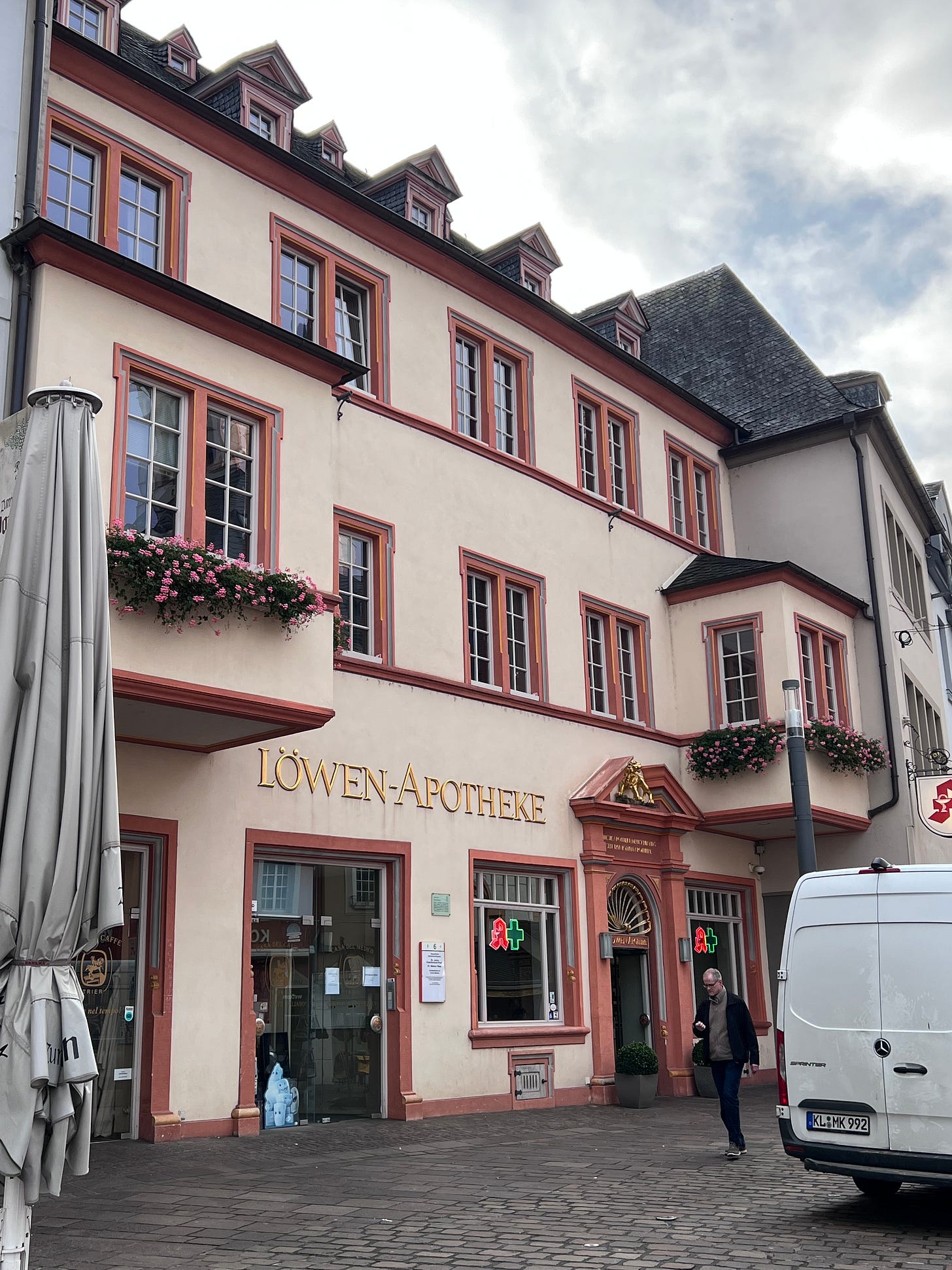 exterior of a pink building labelled lowen-apotheke