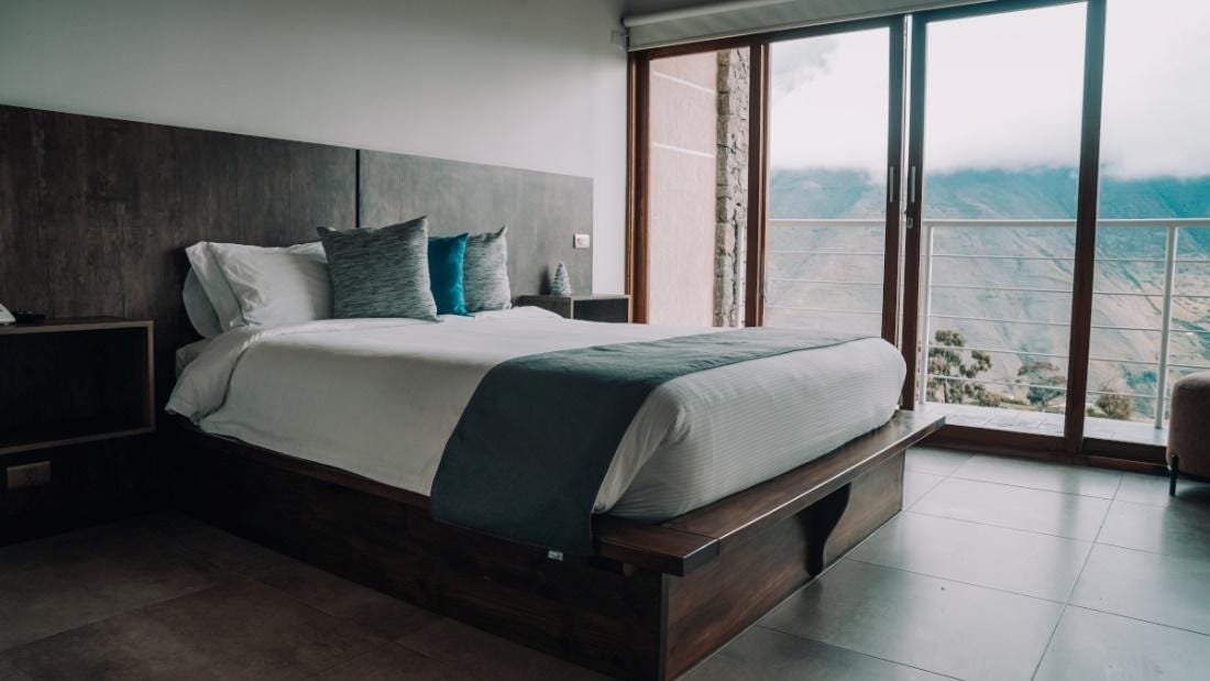 A couple of beds in a room

Description automatically generated with low confidence