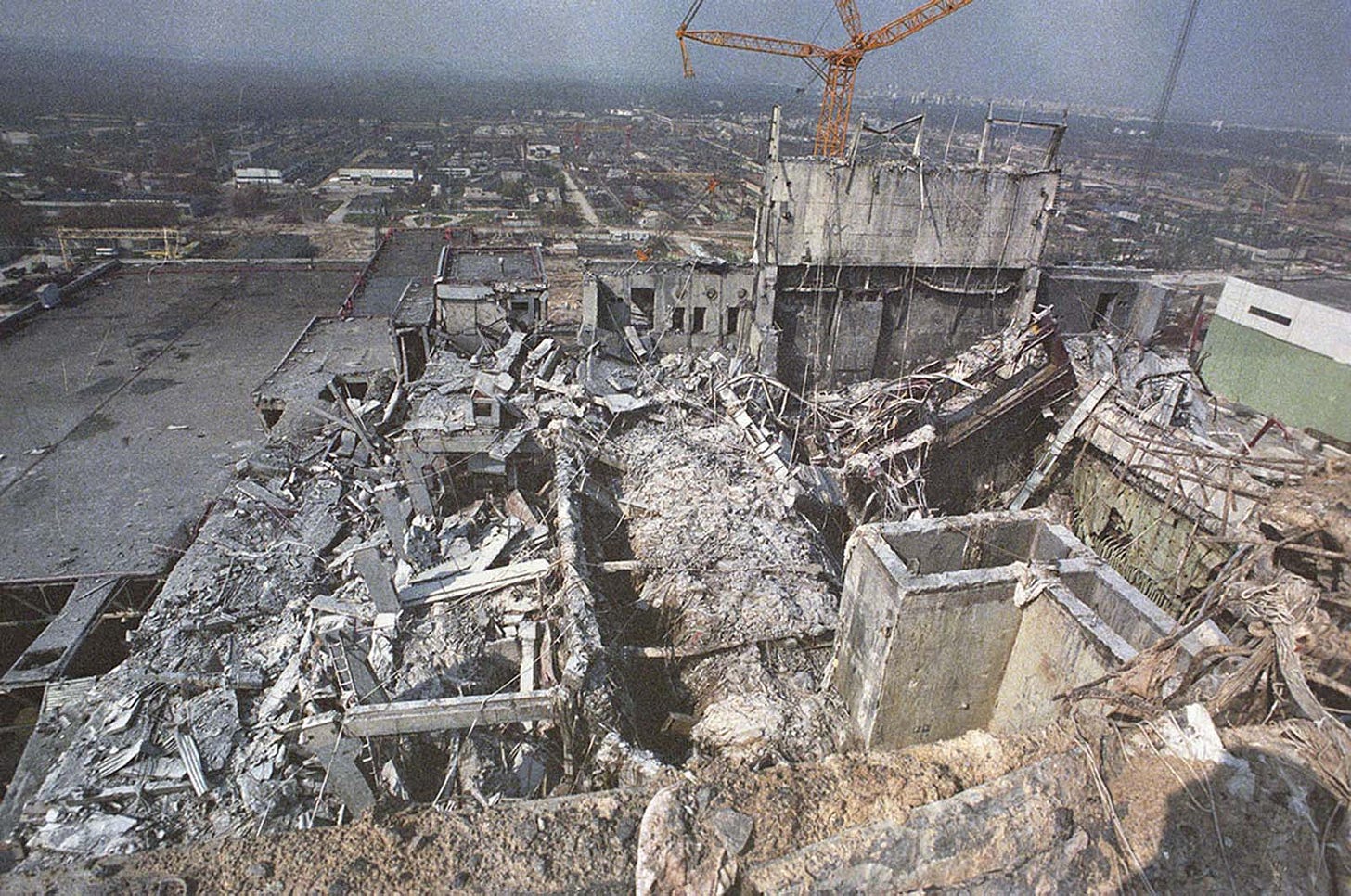 A haunting view of the shattered remains of Reactor No. 4, seen from the adjacent roof of Reactor No. 3.