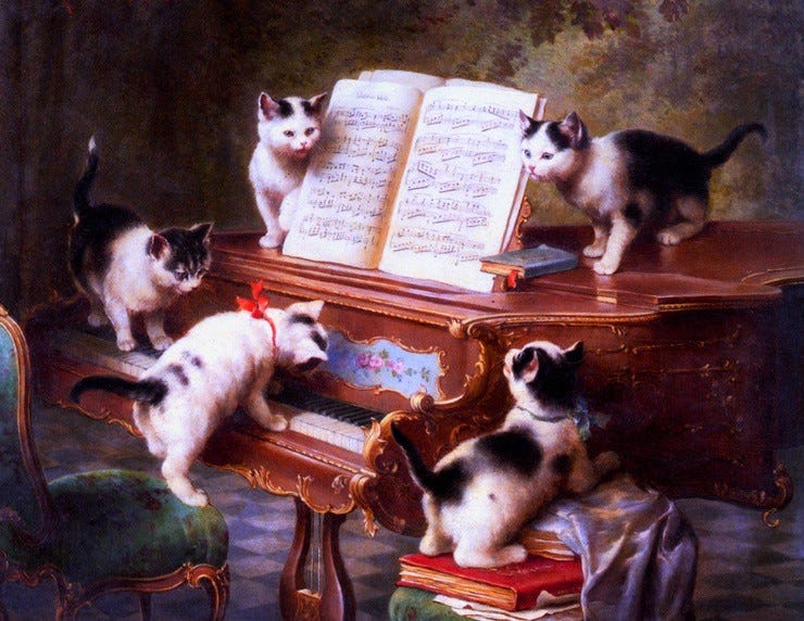 Kittens playing the piano