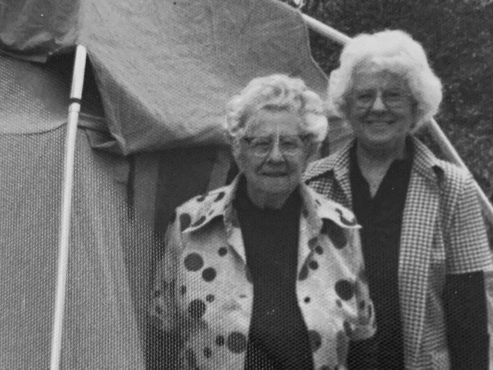 My great-grandmother and grandmother pitching a tent. My great-grandmother and grandmother pitching a tent.