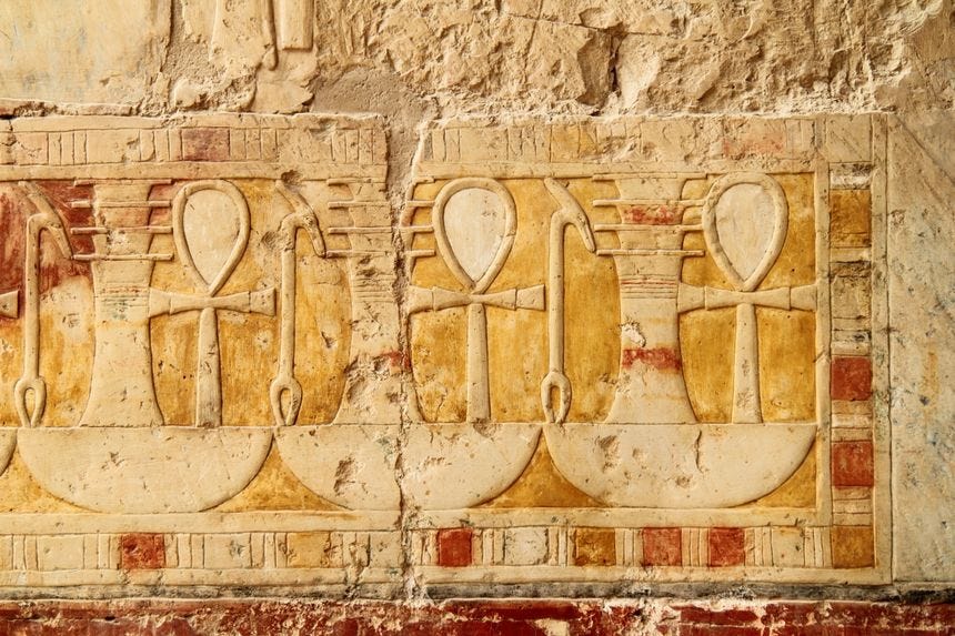 Frieze of ankh, djed, and was signs atop the hieroglyph for "all" Frieze of ankh, djed, and was signs atop the hieroglyph for "all"