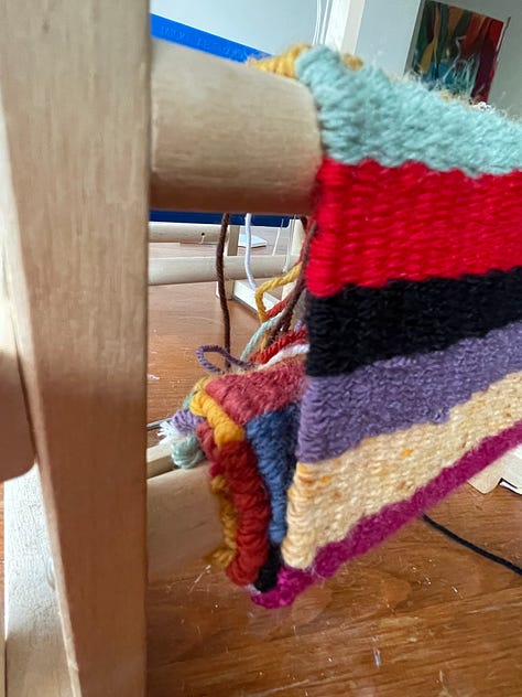 loom in trash and then being used to weave a striped textile