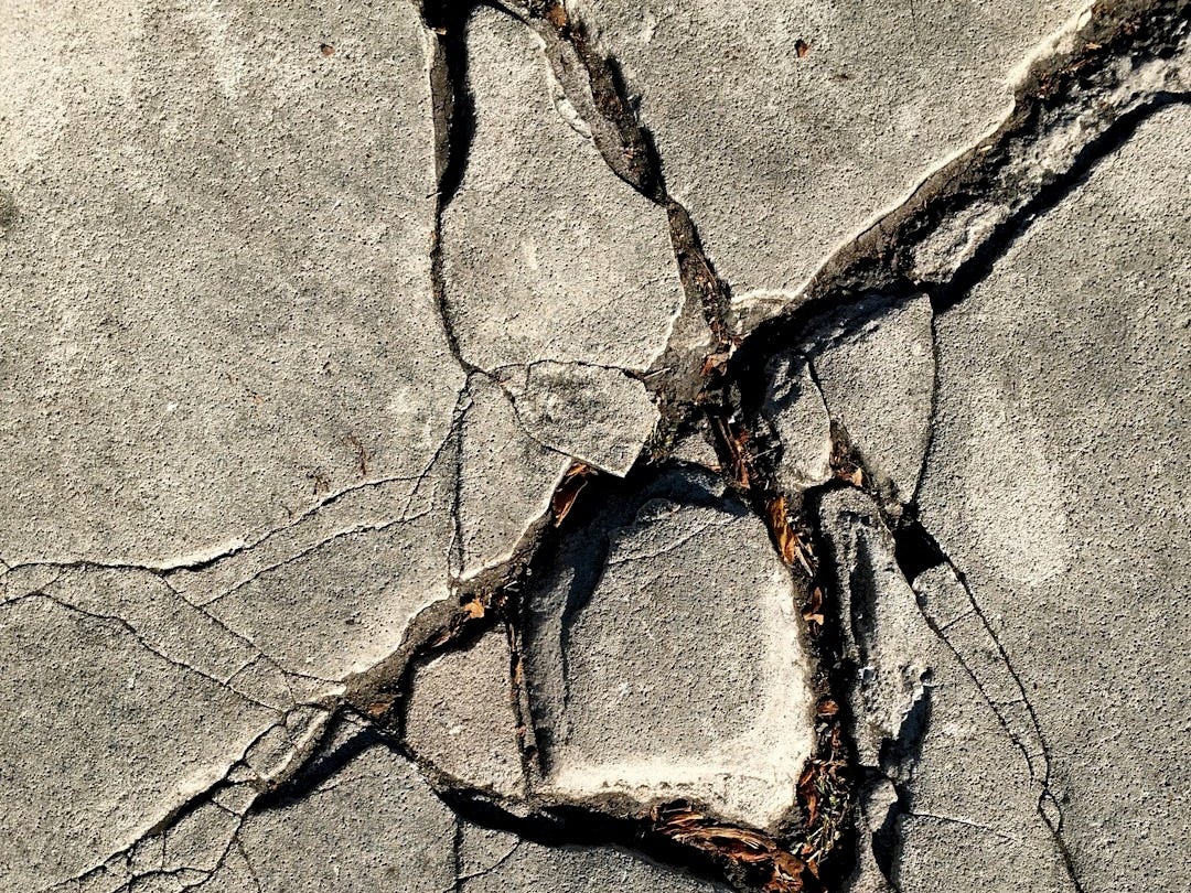close-up photo of broken concrete wall