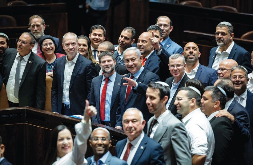 PRIME MINISTER Benjamin Netanyahu and members of his coalition celebrate the passage of the state budget yesterday. (photo credit: YONATAN SINDEL/FLASH90) PRIME MINISTER Benjamin Netanyahu and members of his coalition celebrate the passage of the state budget yesterday. (photo credit: YONATAN SINDEL/FLASH90)