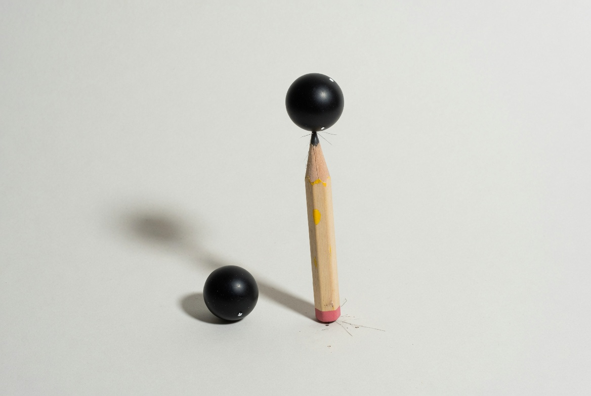 an unstable equilibrium on a light background