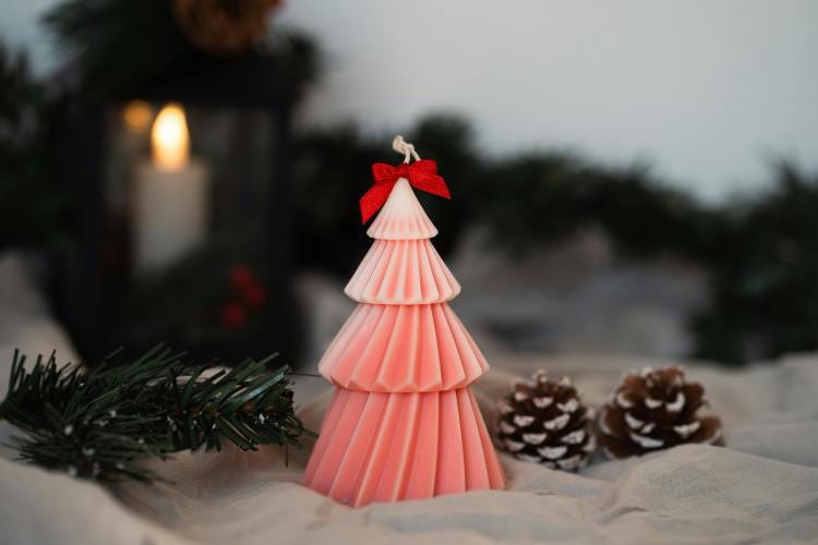 A small, cute, pink Christmas tree with pine cones in the snow - Tis the Season! Holidays Can Be Hard A small, cute, pink Christmas tree with pine cones in the snow - Tis the Season! Holidays Can Be Hard