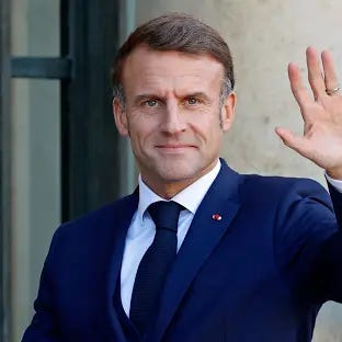 PARIS, FRANCE - OCTOBER 23: French President Emmanuel Macron waves to media as he waits for Lebanese Prime Minister Najib Mikati prior to their meeting at Elysee Palace on October 23, 2024 in Paris, France. The meeting came ahead of the International Conference in Support of the Population and Sovereignty of Lebanon, which will be held tomorrow in Paris. (Photo by Chesnot/Getty Images)