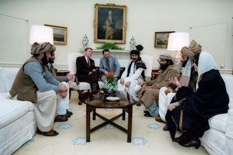 President Reagan meeting with Afghan Mujahideen leaders in the Oval Office in 1983