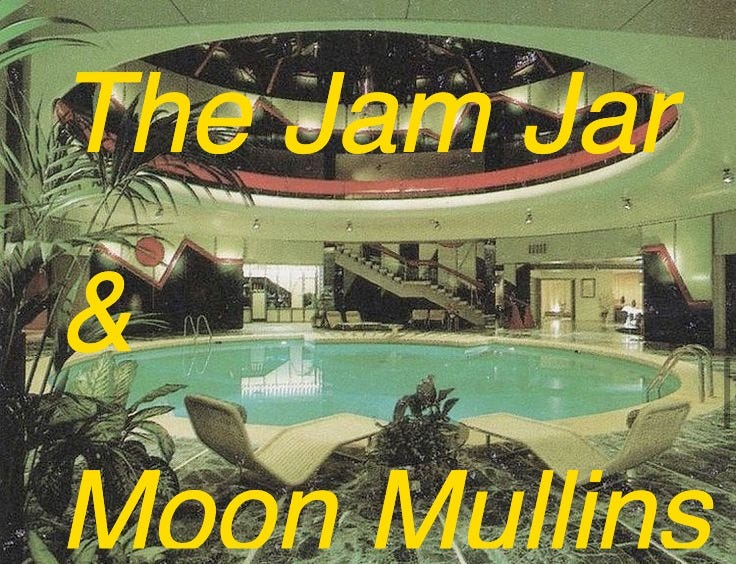 This may contain: an indoor swimming pool with lounge chairs around it