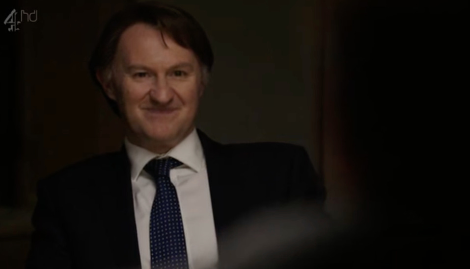 A person in a suit and tie

AI-generated content may be incorrect.