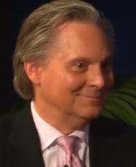 A person in a suit and tie

AI-generated content may be incorrect.