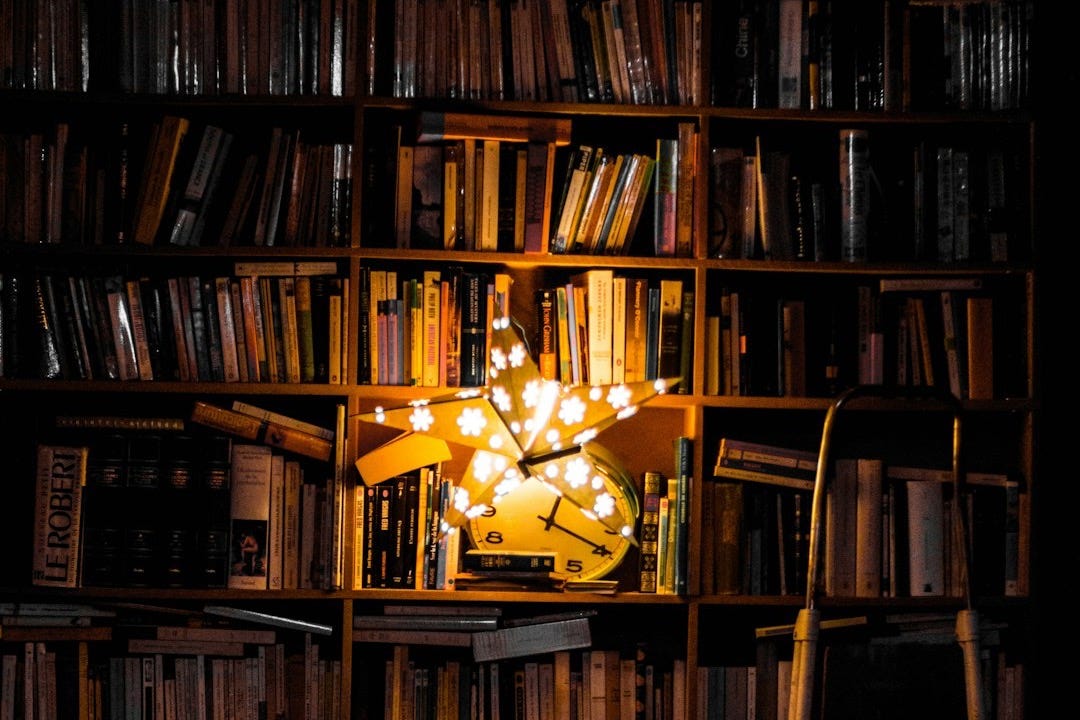 photography of bookshelf and star LED light decor