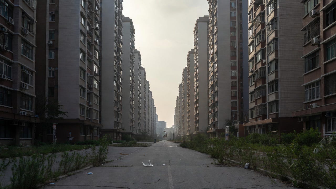 A deserted urban scene in China, showing signs of population collapse with empty buildings and overgrown streets.