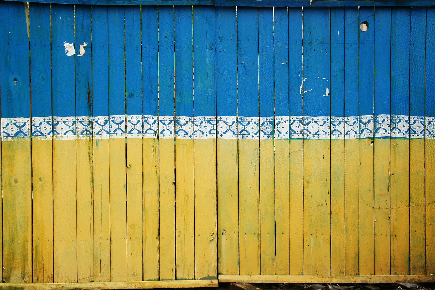 Ukrainian flag painted on a fence
