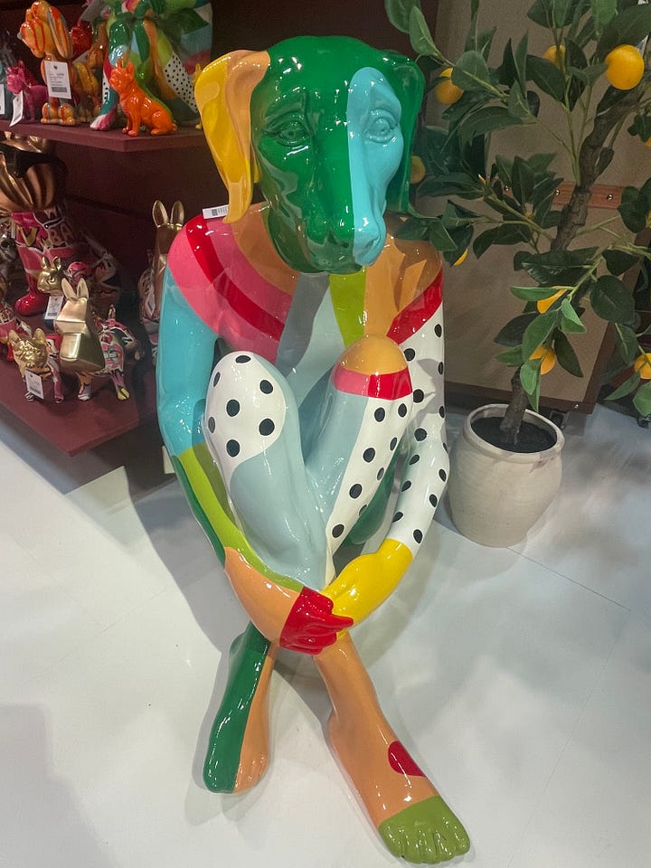 Playful tabletop lighting display at Maison & Objet Paris 2026 featuring bold sculptural lamps, saturated colors, glossy finishes, and pop-art inspired forms. Colorful sculptural decor figure at Maison & Objet Paris 2026 with hand-painted patterns, high-gloss finish, and whimsical contemporary design.