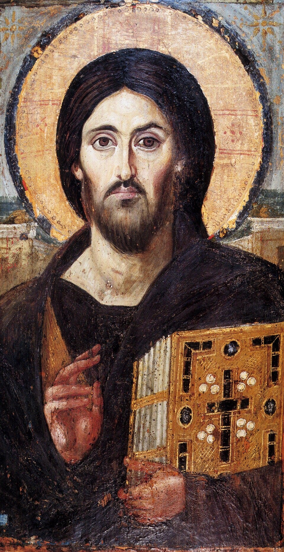 A depiction of Jesus, titled Christ Pantocrator, 6th century AD, holding Bible in front of the sun. Christ's features on his right side (the viewer's left) are theorized to represent the qualities of his human nature, while his left side (the viewer's right) represents his divinity. A depiction of Jesus, titled Christ Pantocrator, 6th century AD, holding Bible in front of the sun. Christ's features on his right side (the viewer's left) are theorized to represent the qualities of his human nature, while his left side (the viewer's right) represents his divinity.