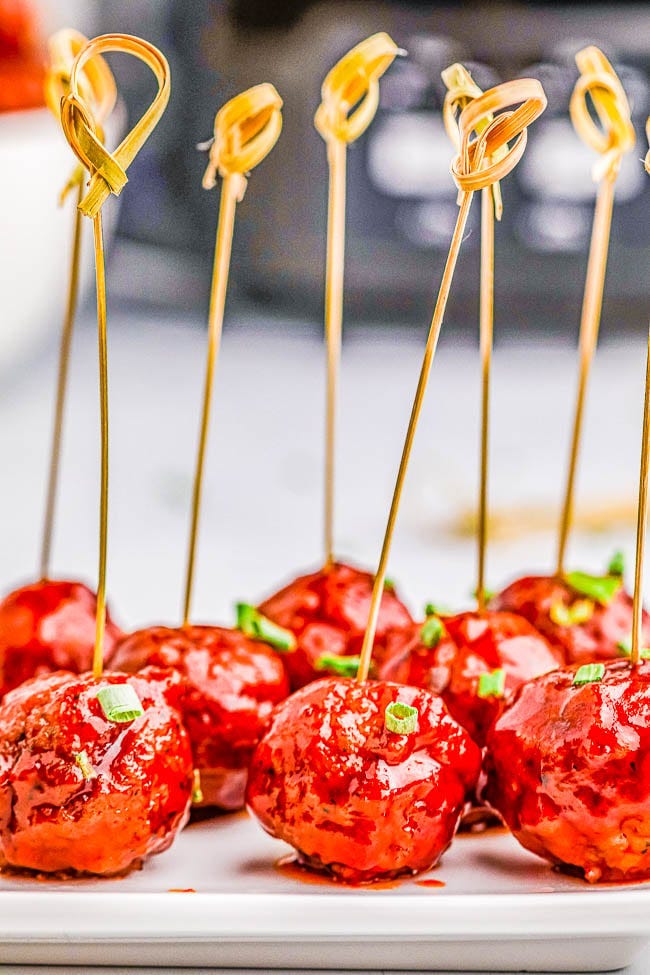Slow Cooker Grape Jelly Meatballs speared with toothpicks. 